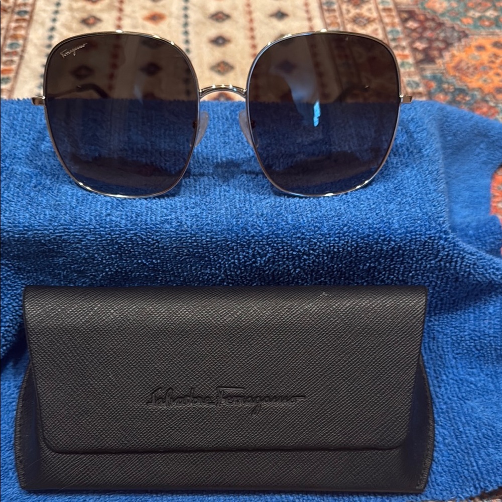 Salvatore Ferragamo sunglasses with Black Textured Case. Very Classy style